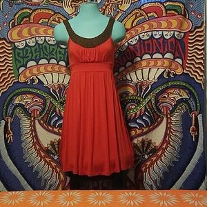 Orange dress with beaded detailing.